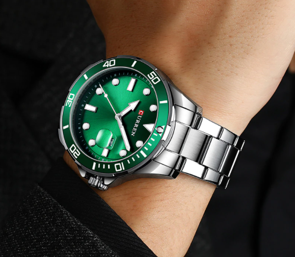 Stylish BIJOU GREEN LUXURY CURREN WATCH on wrist, featuring a unique green dial and a sleek silver band.